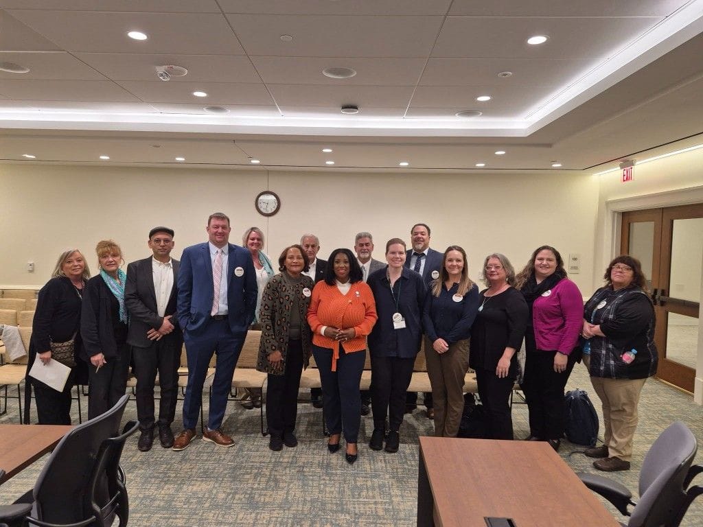 VAPCP members standing together in a legislative hearing room