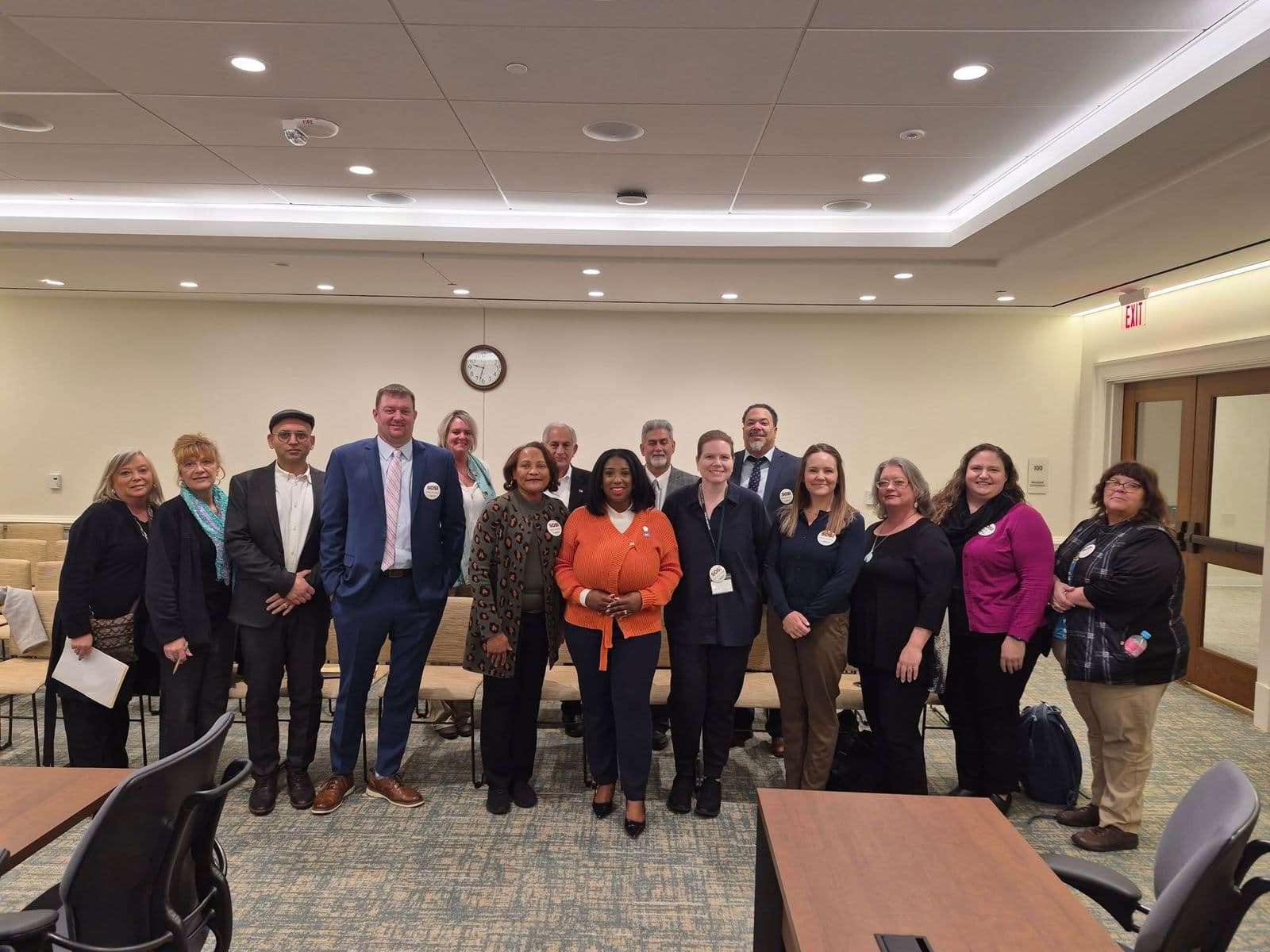 VAPCP members standing together at a meeting
